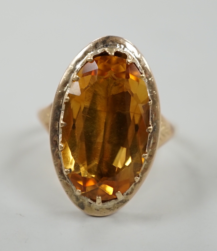 A 22ct gold and citrine set ring, composed from a 22ct gold shank and a George III mourning ring.